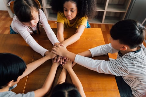 school-age-group-children-hands-in